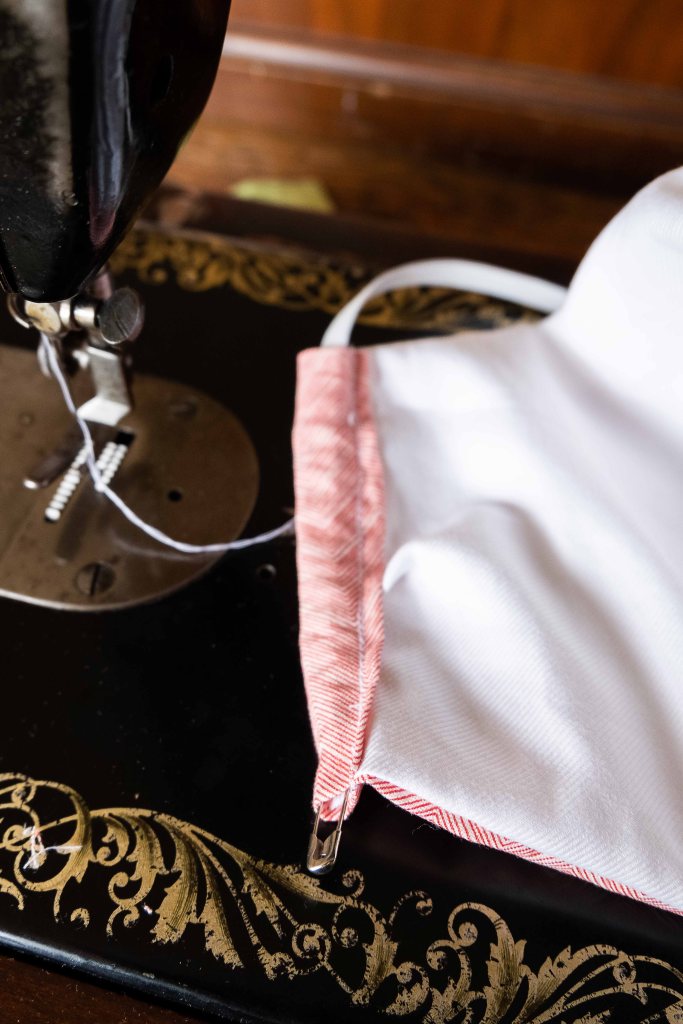 Putting the elastic - face mask sewing process