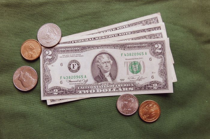 2 dollars bills and coins