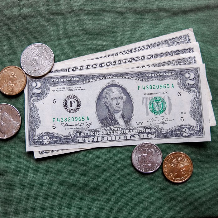 2 dollars bills and coins