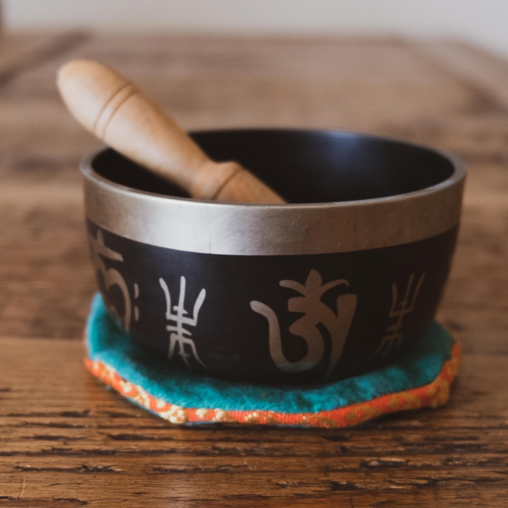 Meditating with a singing bowl