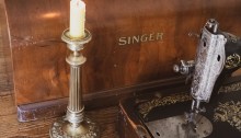 Vintage candlestick and vintage sewing machine